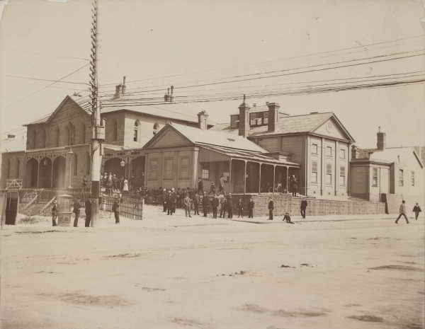 Black and white photographs of a street scene showing the old Supreme Court building on the corner of Russell and La Trobe Streets taken in the mid 1800's.